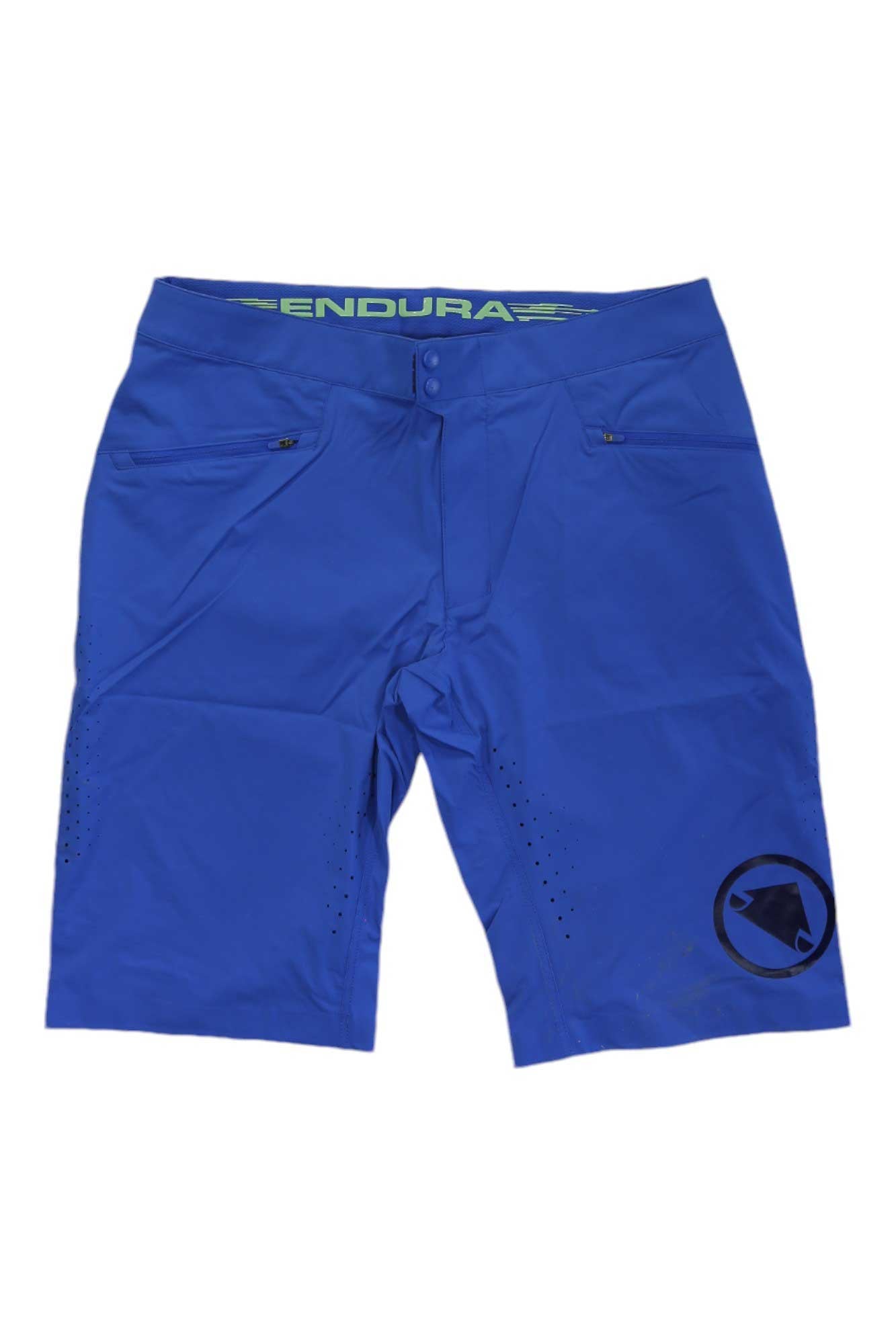 The Endura Men's SingleTrack Lite Short in bright blue, made from stretch nylon with zippered pockets and a black logo on the lower left leg, is shown flat on a white background—perfect for mountain biking.