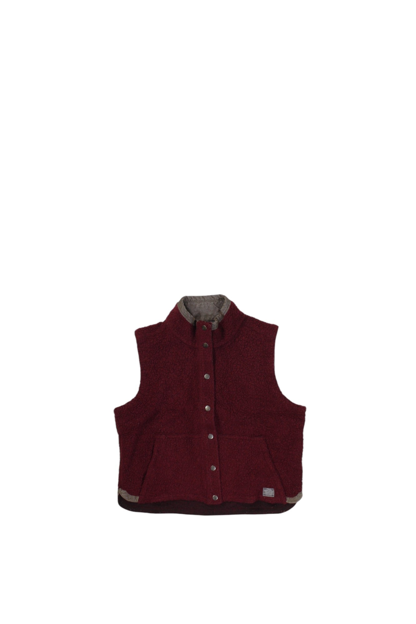 The Toad & Co Womens Sheridan Sherpa Vest is a sleeveless maroon fleece vest with a high collar, snap-button front, and two front pockets. Wind-resistant, it’s shown laid flat on a white background.