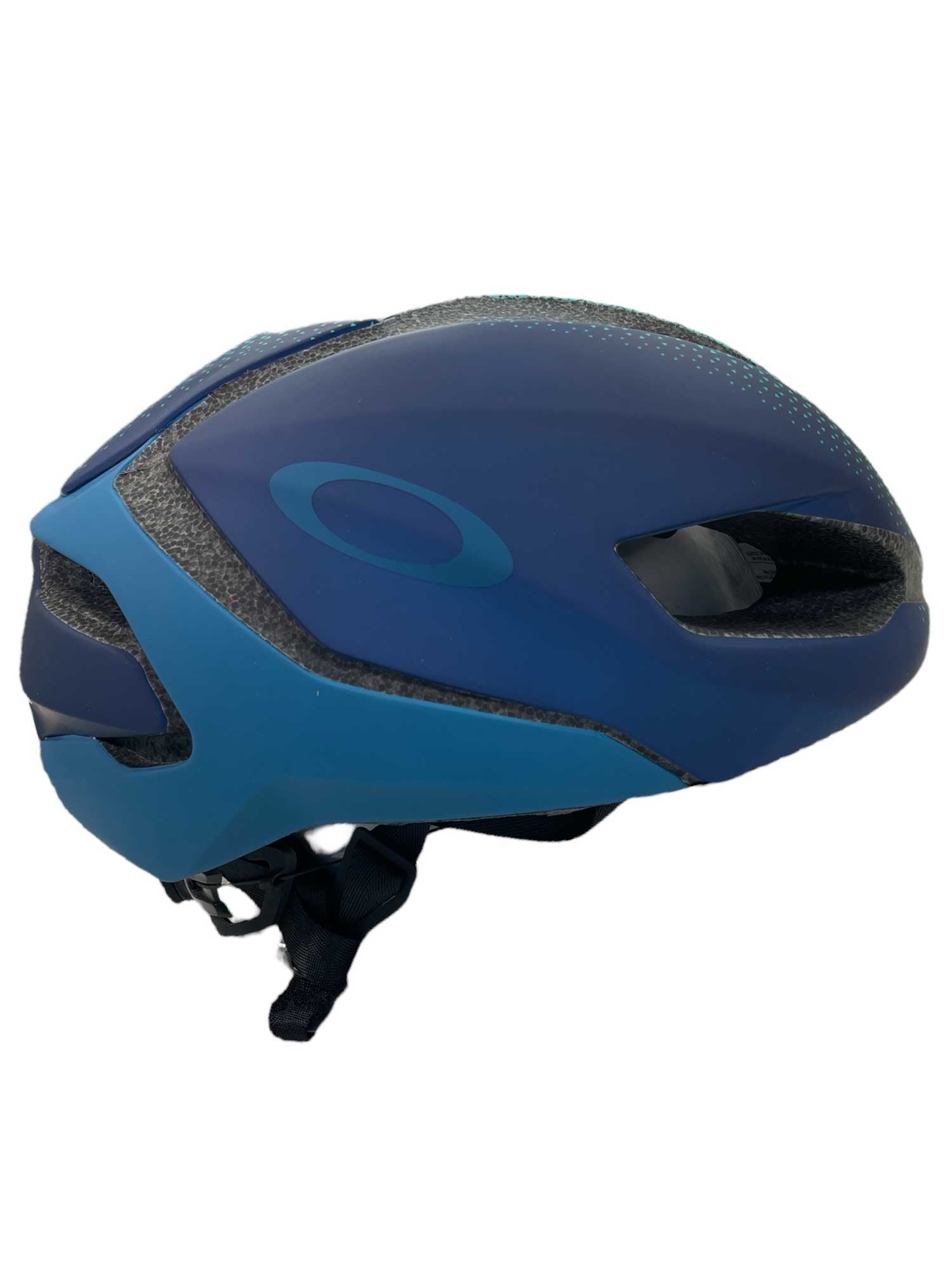 The Oakley ARO5 Helmet in blue features air vents, an adjustable chin strap, MIPS Brain Protection System, and a subtle side logo. Shown in side profile view, it includes an integrated eyewear dock for added convenience.