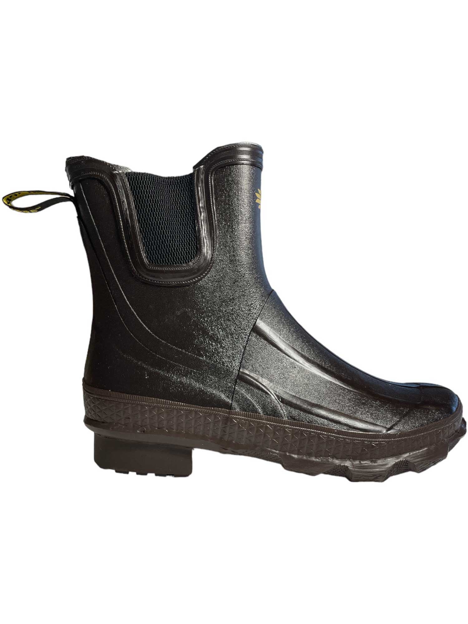 The Lacrosse Womens Grange Chelsea 5 Boot is a black rubber ankle boot with a snug fit, textured sole, elastic side panels, and back pull tab. Waterproof and ideal for wet or muddy conditions. Shown in side profile.