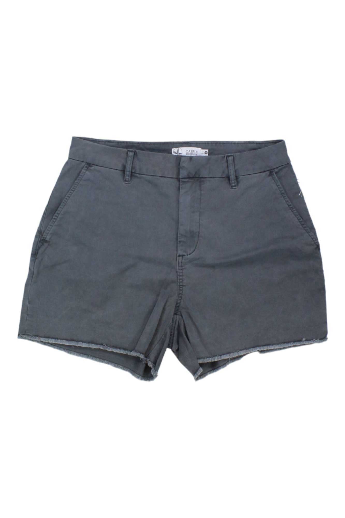 Carve Designs Women's Sausalito 4 Inch Shorts in dark gray cotton feature belt loops, side pockets, and a raw hem, shown laid flat on a white background.
