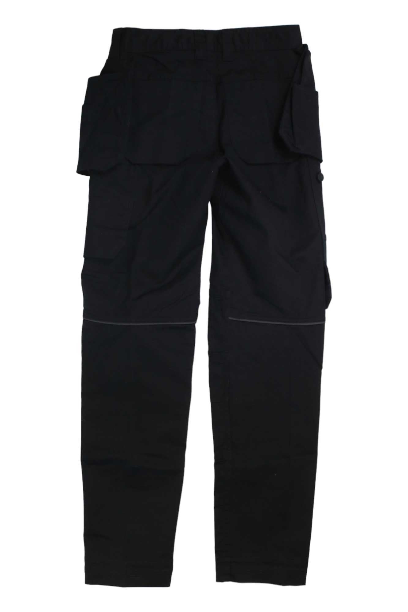The Helly Hansen Womens Luna Light Construction Pant in black features multiple pockets, stretch fabric, and articulated knees for comfort and durability, shown laid flat on a white background.