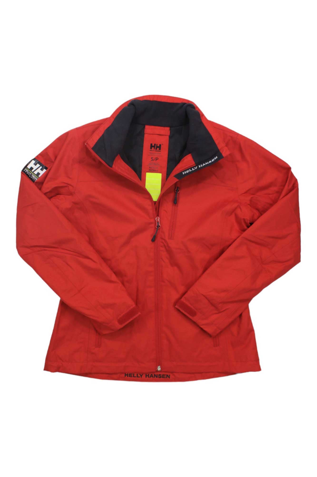 The Helly Hansen Womens Crew Midlayer Jacket in red features a front zipper, zippered chest pocket, and logo patches on the left sleeve and collar, shown against a white background.