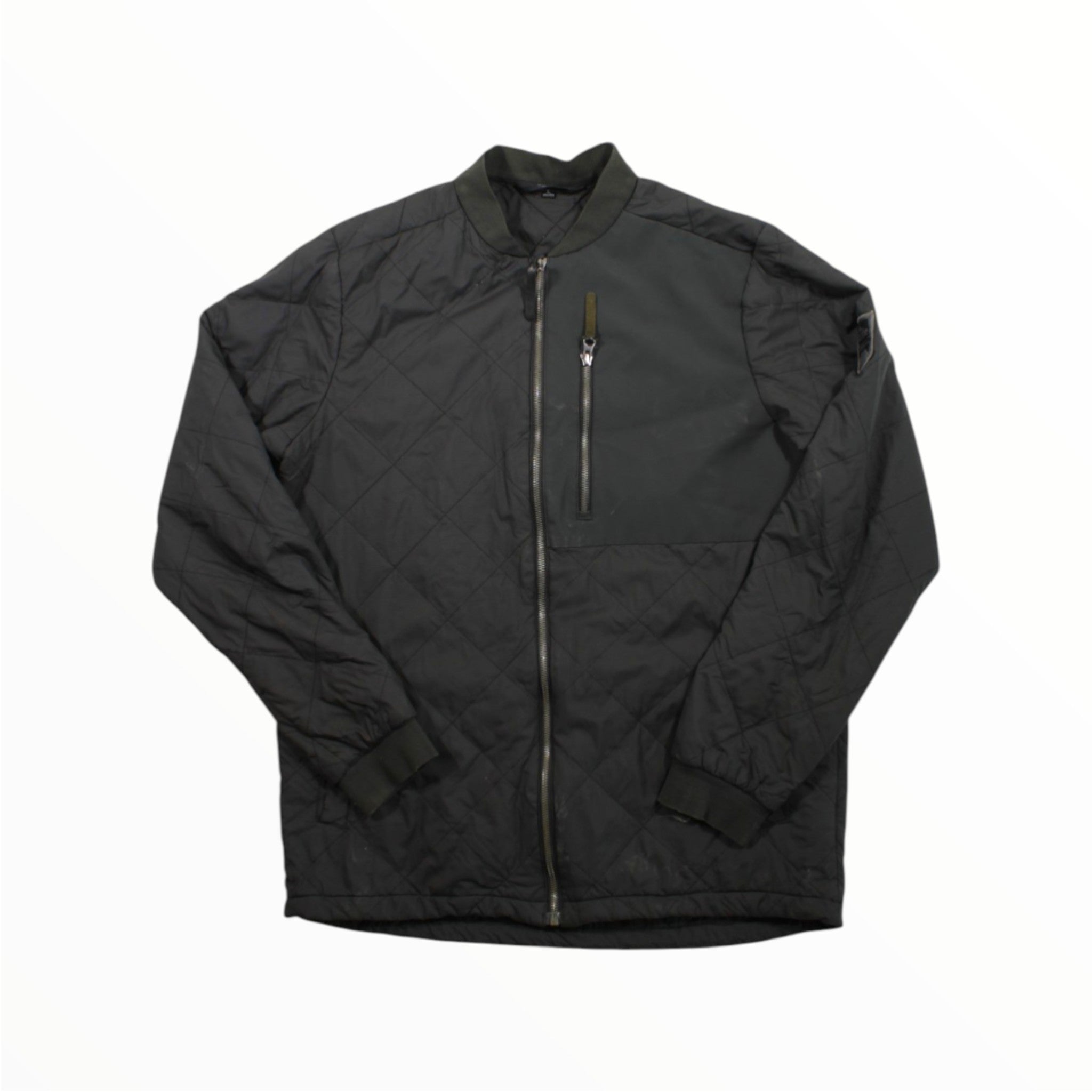 The Strafe Mens Insulated Bomber Jacket in black features a front zipper, zippered chest pocket, and long sleeves—ideal men's winter outerwear for stylish outdoor performance. Laid flat on a white background.