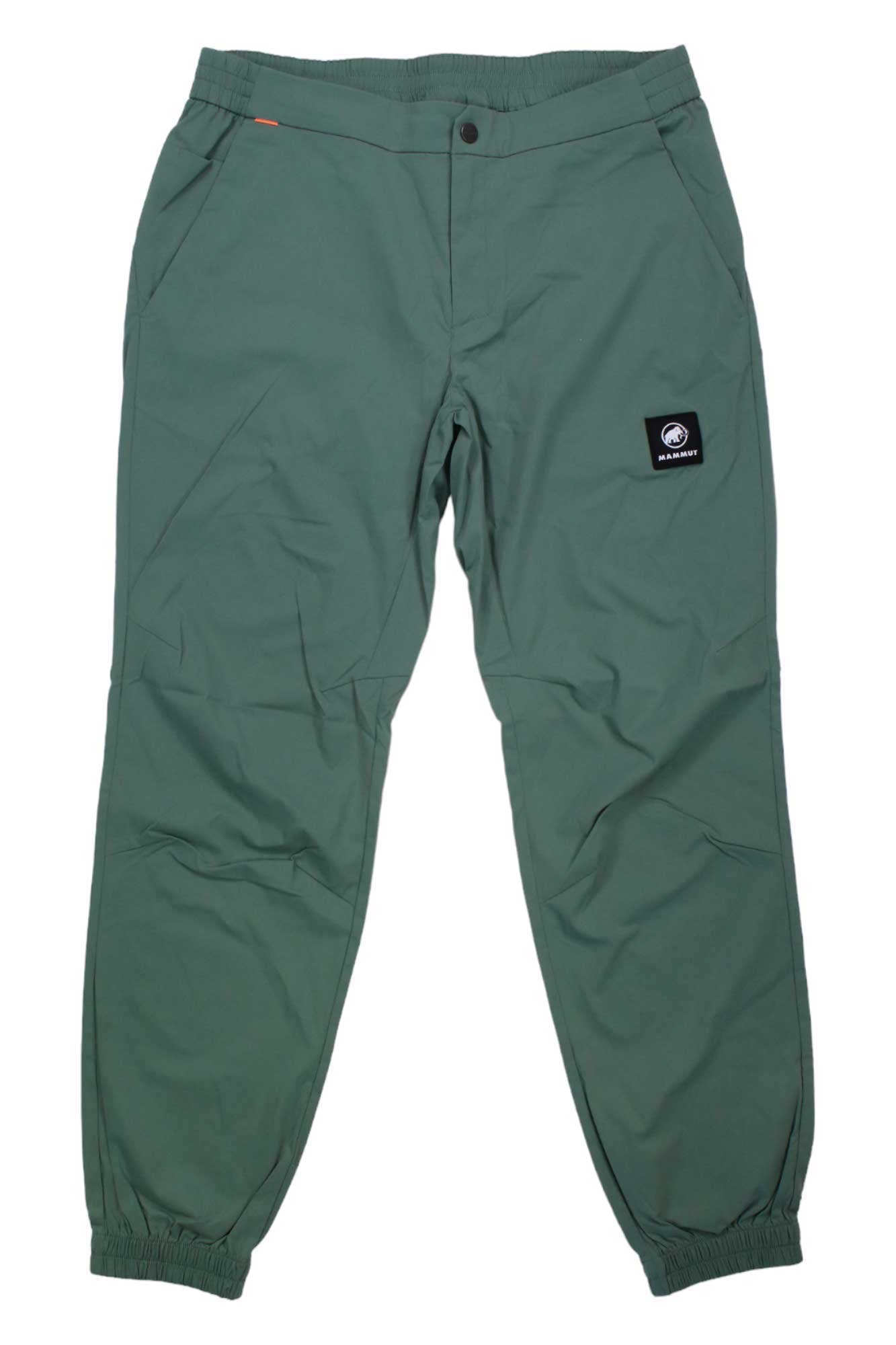 The Mammut Mens Massone Light Pant is a green jogger-style hiking pant featuring elasticated cuffs and waistband, front pockets, and a black rectangular patch with white logo on the upper right thigh, laid flat on a white background.