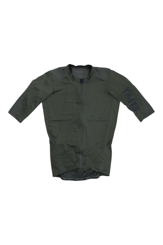 The Pro Team Aero Jersey II is a dark green cycling jersey with three-quarter sleeves, a front zipper, and “TRAPA” printed in black on the left sleeve, shown laid flat on a white background.