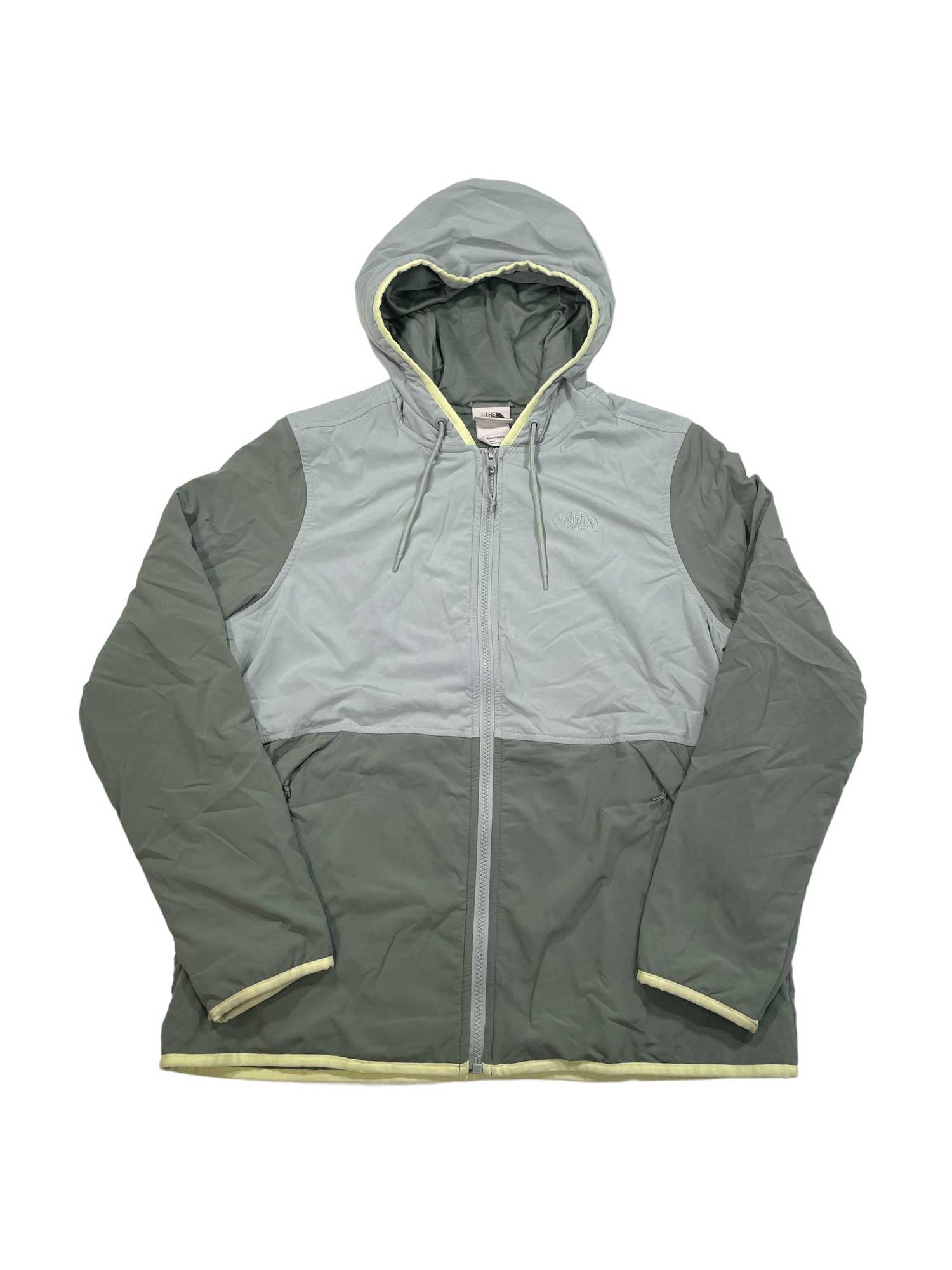 The Women's Mountain Sweatshirt Hoodie 3.0 by The North Face is a hooded, zip-up sweatshirt with long sleeves in two green shades—light on top, darker on the lower part and sleeves. It has front pockets and a drawstring hood for comfort.