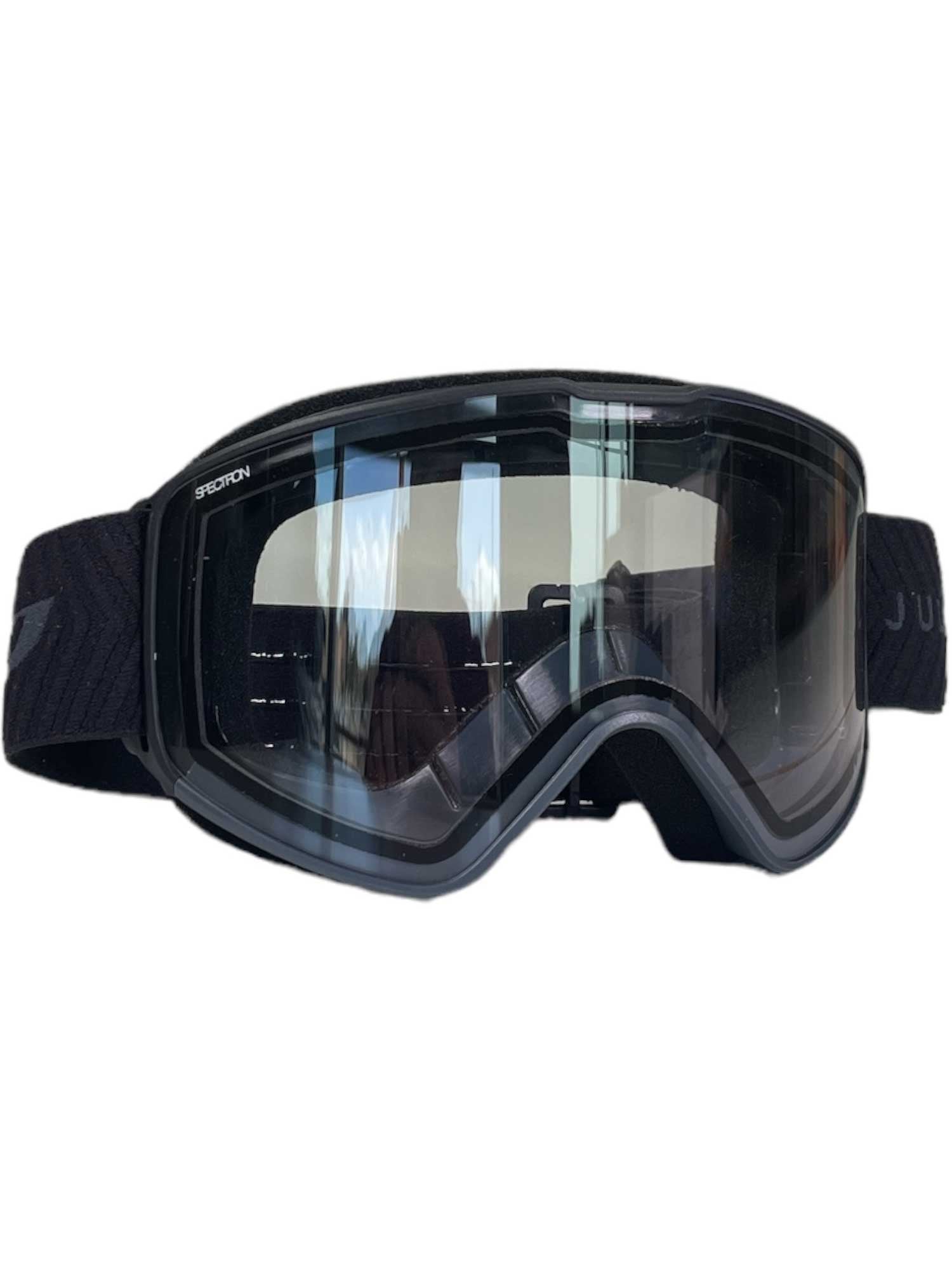 The Julbo Alpha Goggle, shown on a plain white background, features a wide, clear polycarbonate lens with anti-fog coating and an adjustable strap.