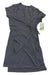 The Stonewear Designs Women's Orchard Dress is a short-sleeve, knee-length charcoal gray casual dress with a V-neckline and matching waist tie, shown flat with a tag attached.