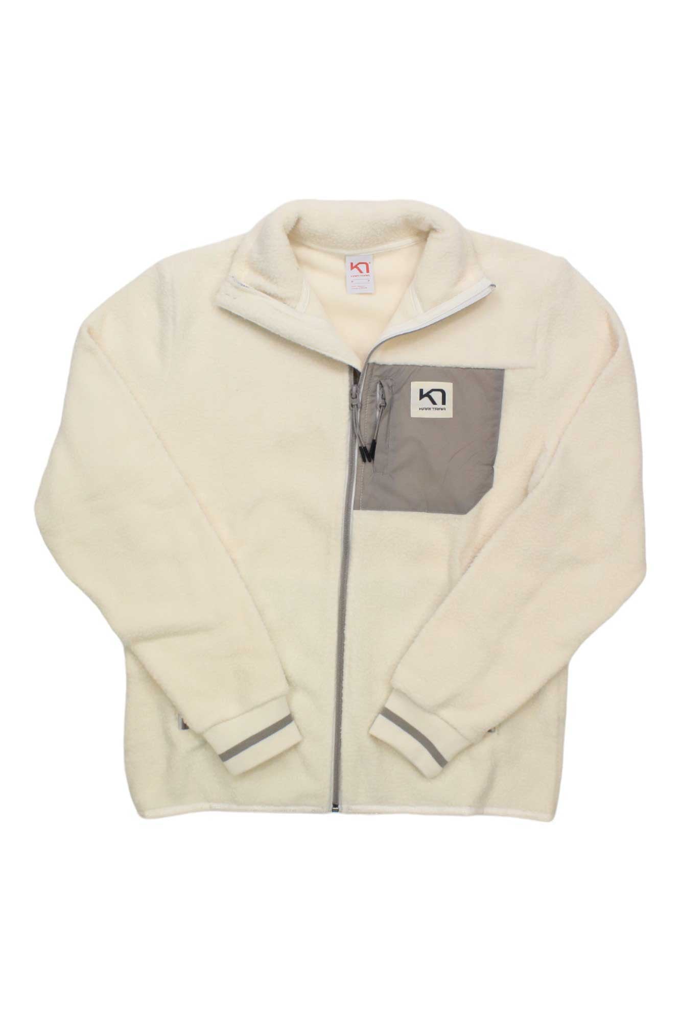 The Rothe Fleece Jacket is a cream fleece with a gray chest pocket and black and white logo; this bluesign-approved women’s jacket is ideal for chilly snowsports adventures.
