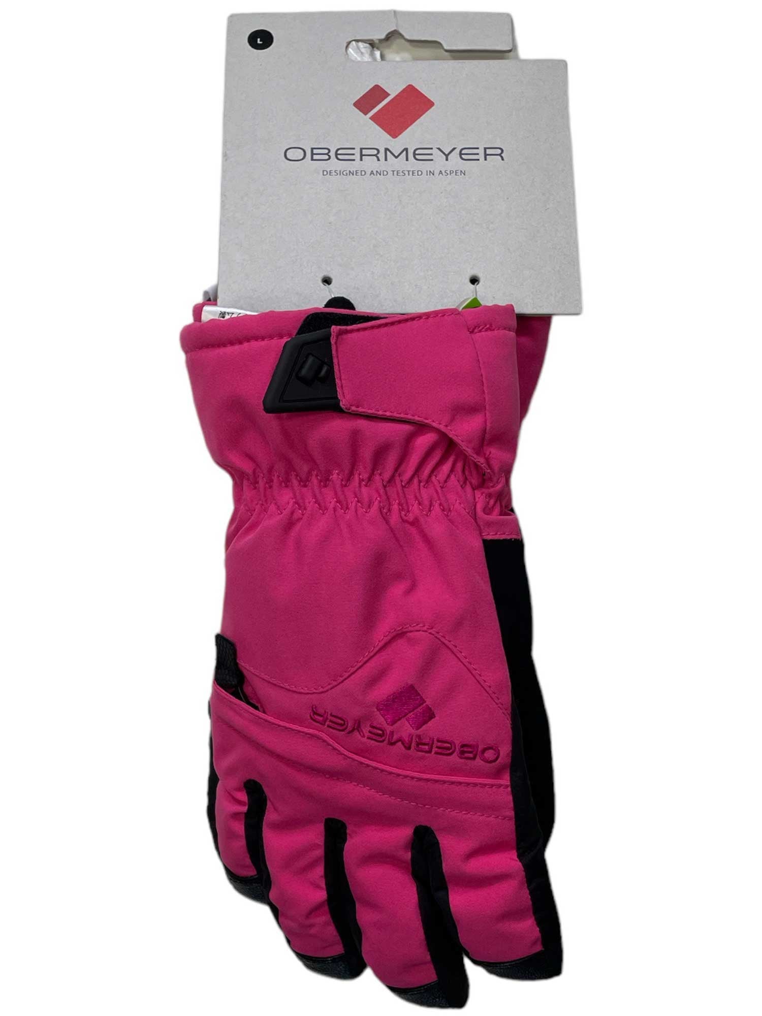 A pair of Obermeyer Kids Teens Lava Gloves in bright pink with black accents, attached to a white display card showcasing the Obermeyer logo and branding.