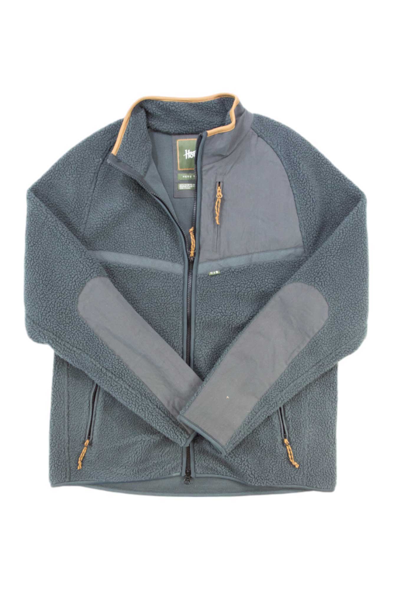 Men's dark navy fleece jacket with tan-trimmed collar, zip chest pocket, and side zips