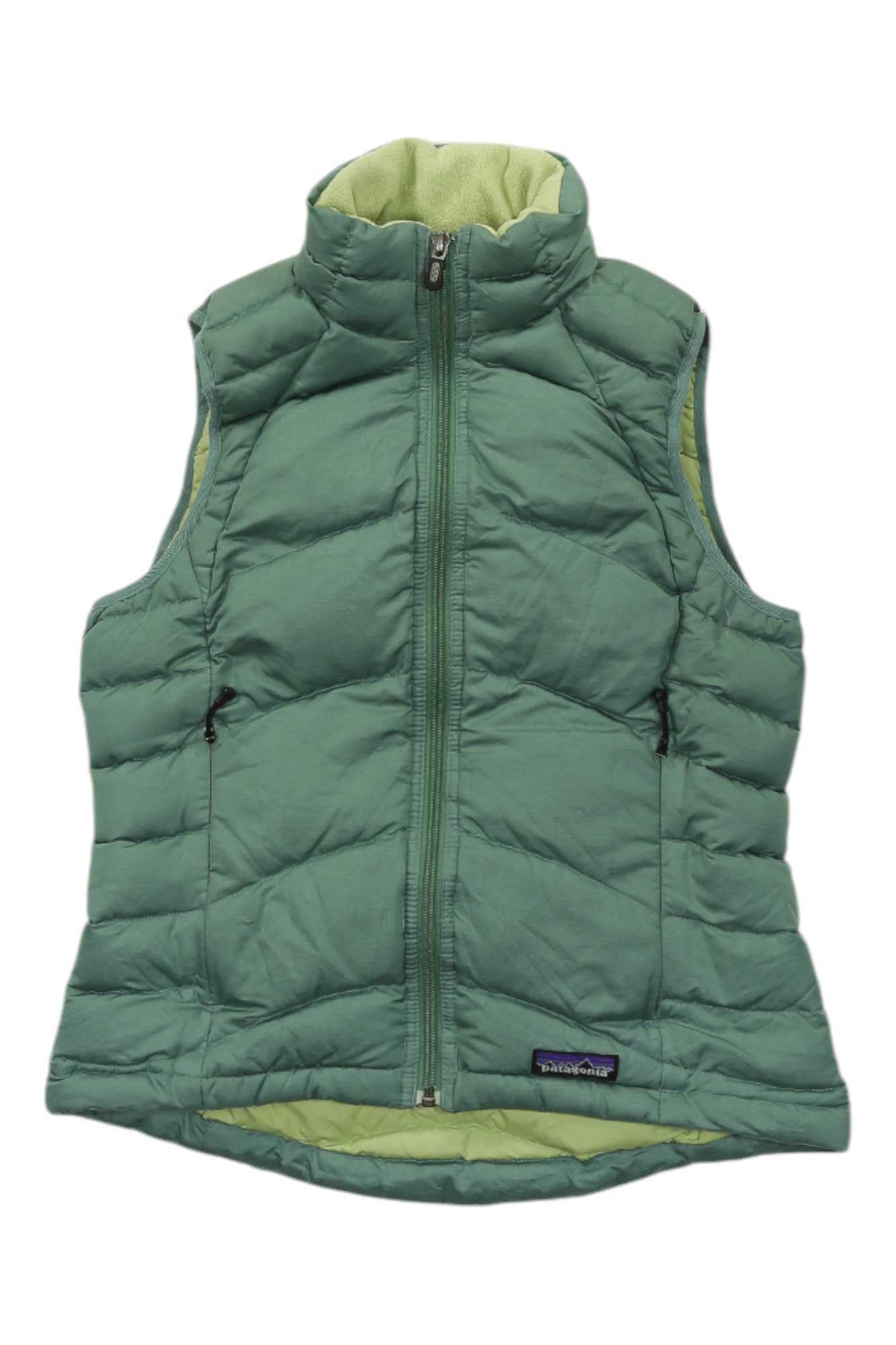 The Womens Down Vest features a green color, front zipper, two zippered side pockets, stand-up collar with light green lining, eco-friendly lightweight warmth, and a Patagonia logo tag on the lower front.