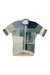 The Rapha Pro Team Training Jersey, a short-sleeve high-performance cycling top, features a geometric green, beige, gray, and blue pattern, front zipper, and high collar. Shown laid flat on a white background.