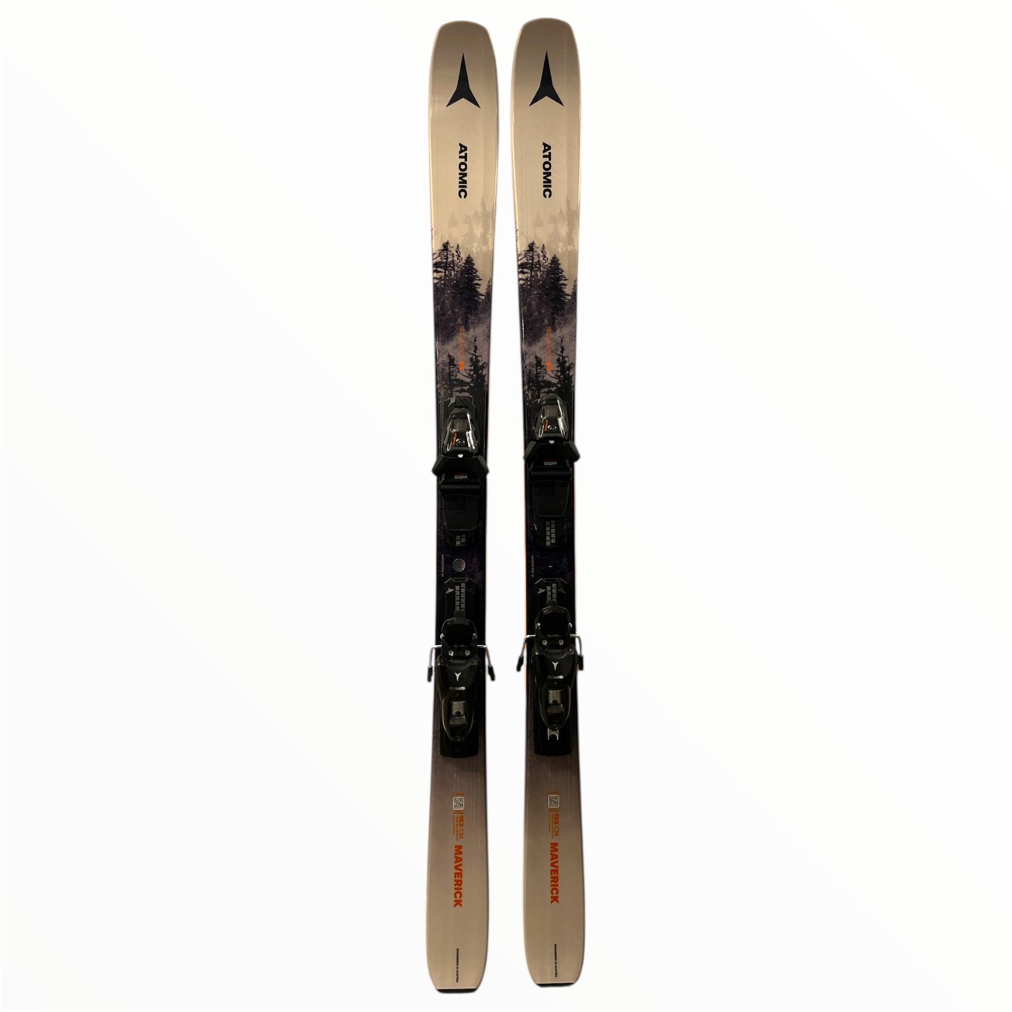 The Atomic Maverick 84 Skis + M10 GW Bindings are all-mountain skis featuring a mountain landscape with trees on a white and gray background and the Atomic logo near the tips.