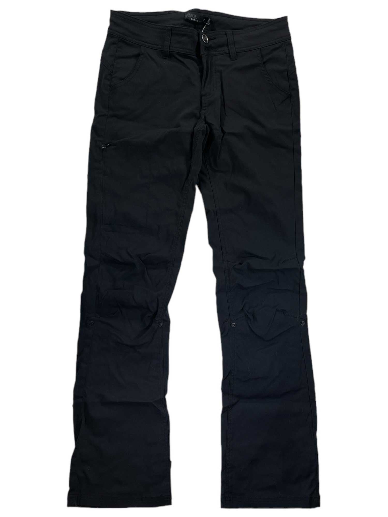 The Halle Pant II, shown flat on a white background, is a pair of black cargo pants featuring front and side pockets, button and zipper closure, and durable performance fabric.