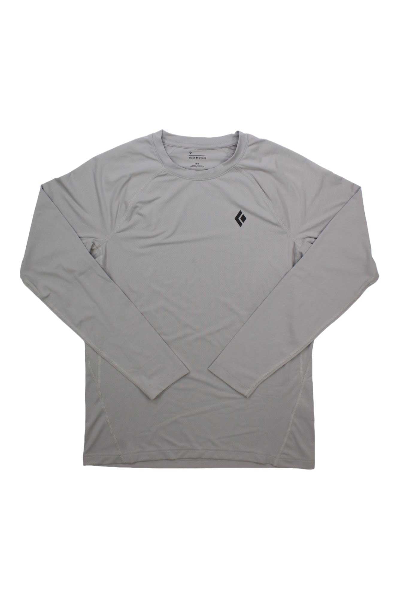 The Black Diamond Men's Alpenglow Crew is a light gray long-sleeve athletic shirt with a small black geometric logo on the left chest and UPF 50+ sun protection, shown on a plain white background.