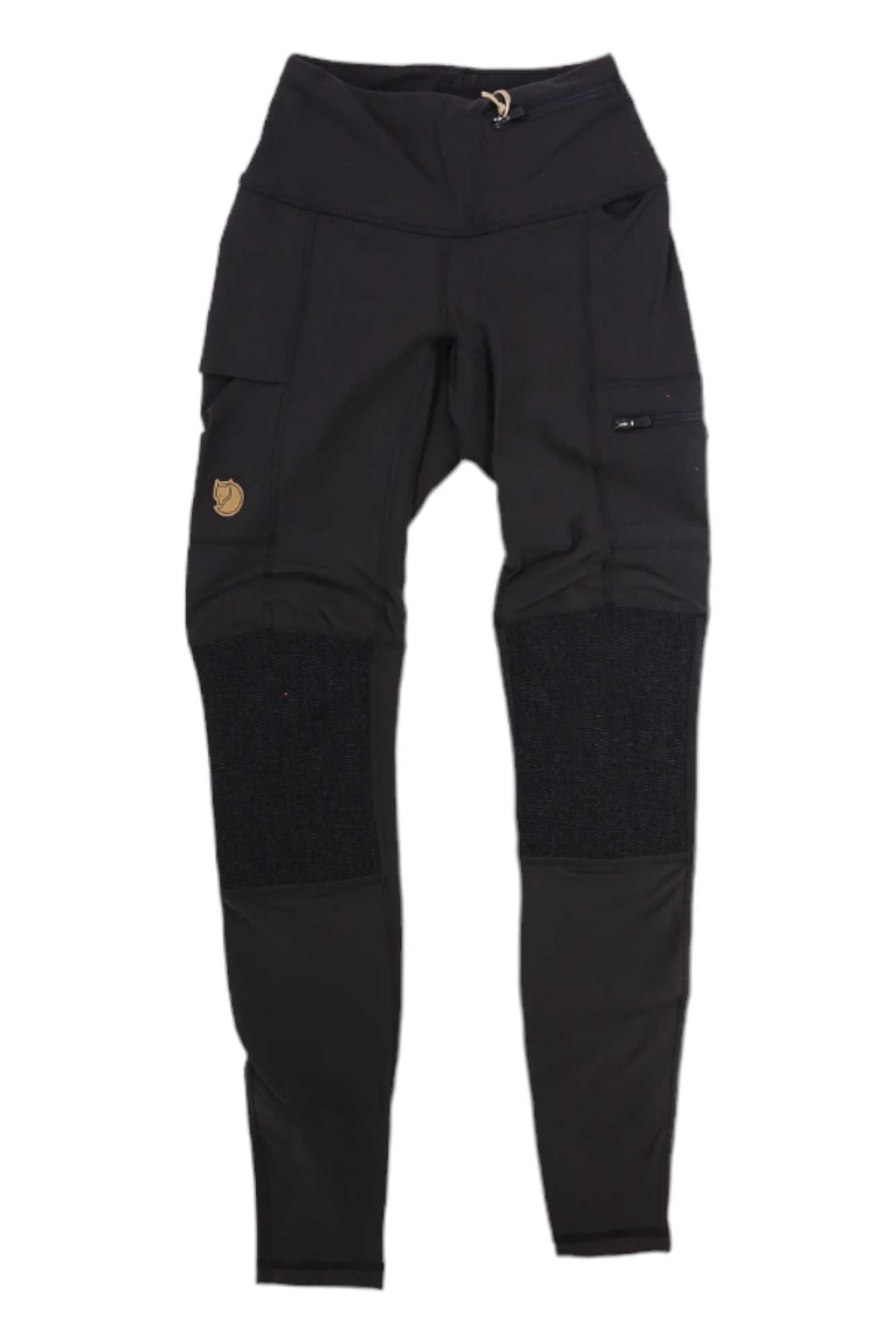 The Fjallraven Womens Abisko Trekking Tight, designed for Black women, features reinforced knee patches, multiple pockets, and a small circular brown logo on the upper left thigh. Pants are displayed flat on a white background.