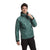 A person in The North Face Mens Circaloft 1/4 Zip Pullover in green with synthetic insulation and black pants stands facing forward, smiling slightly, while adjusting the pullover’s zipper.
