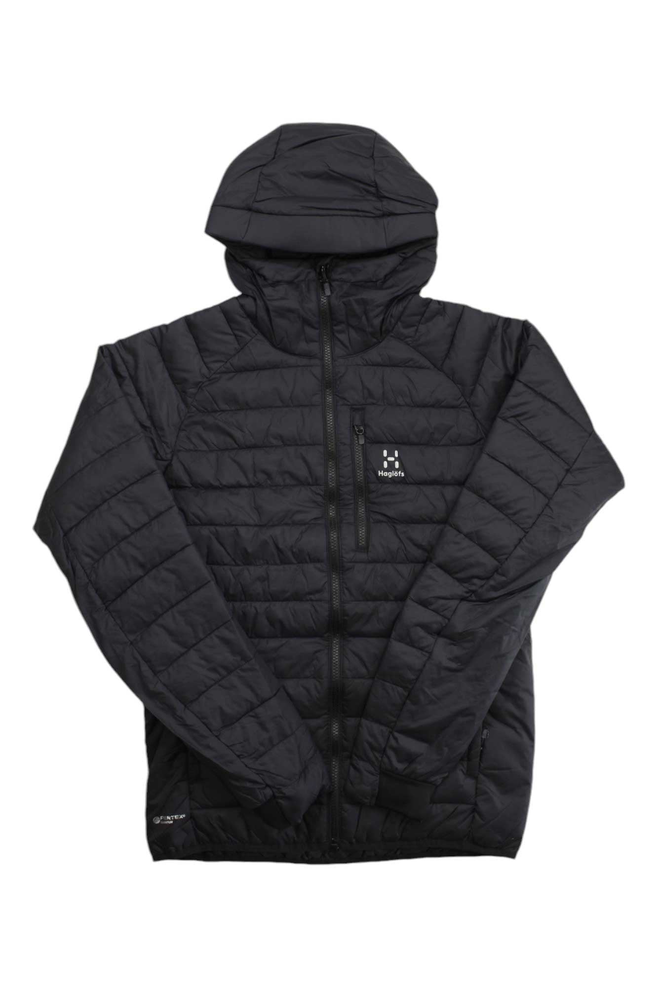 The Haglofs Mens Spire Mimic Hood Jacket is a black, quilted, hooded jacket made from recycled polyester with a front zipper and logo on the left chest pocket. Lightweight and wind-resistant, it's perfect for outdoor use.