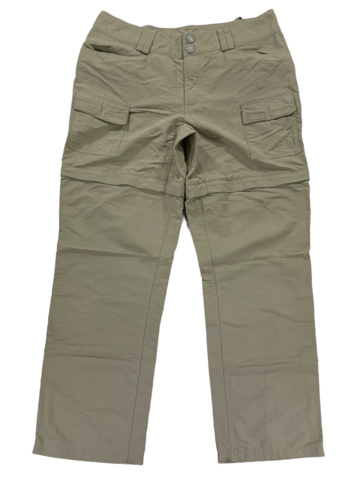 The Women's Paramount II Convertible Pants in light brown feature quick-drying fabric, front buttons, belt loops, two front flap pockets, and straight legs, shown laid flat on a white background.