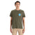 A young man wearing the Icebreaker Mens Tech Lite II SS Tee in green, featuring a small blue and white left chest graphic, pairs it with beige shorts while standing against a white background.