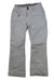 The Obermeyer Womens Malta Pant is a light gray ski pant featuring waterproof fabric, front button and zipper closure, a right zippered pocket, and reinforced stitching at the knees and cuffs.