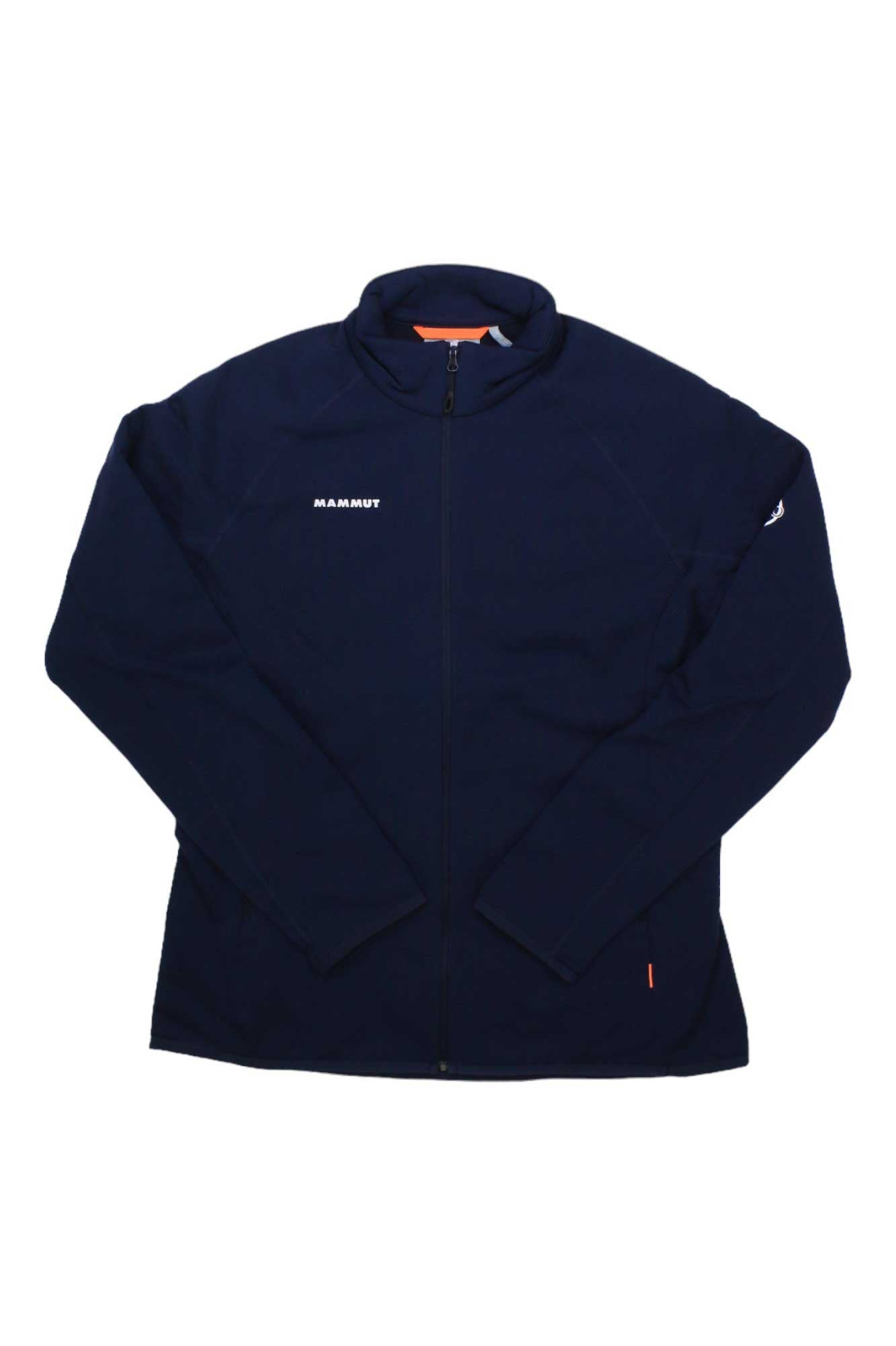 A navy Mammut Womens Aconcagua ML Jacket with long sleeves, white Mammut logo on the left chest and sleeve, made of Polartec Power Stretch Pro for climbing, is laid flat on a white background.