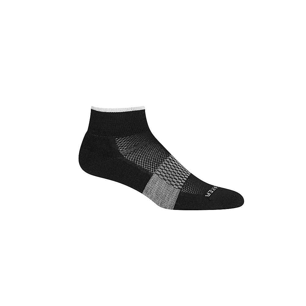 The Icebreaker Women's Multisport Light Mini Sock in black with gray and white accents, features light cushioning and a textured mesh midsection, shown against a white background.
