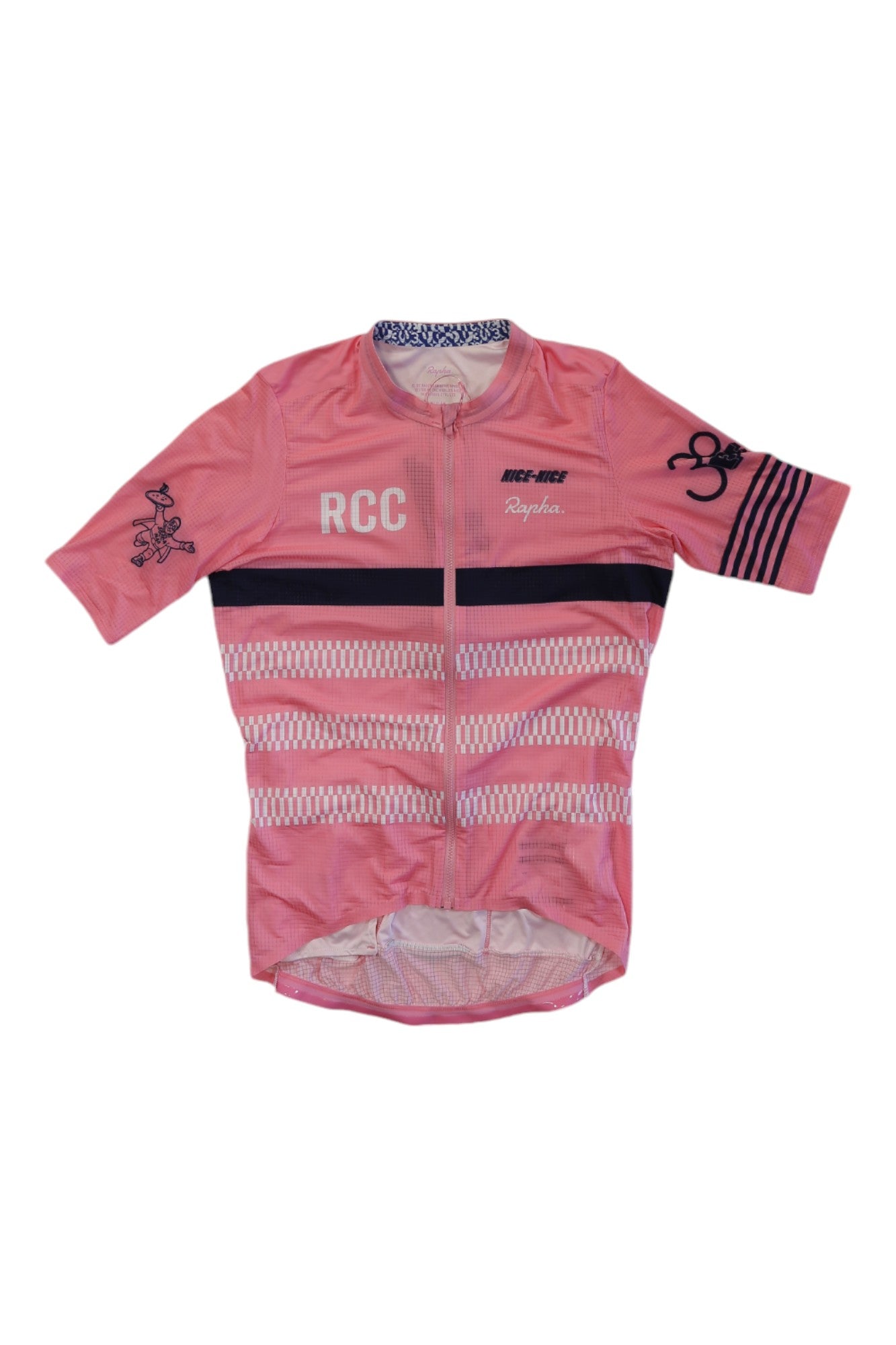 The Rapha Mens Etape RCC Pro Team Flyweight Jersey is a pink, short-sleeve performance cycling top featuring geometric patterns, "RCC" text, black stripes, and Rapha branding on the chest and sleeve.