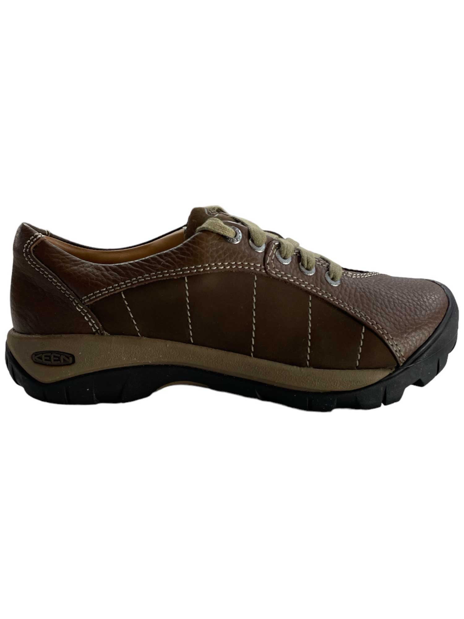 Brown lace-up casual sneaker with stitched design lines and cushioned collar