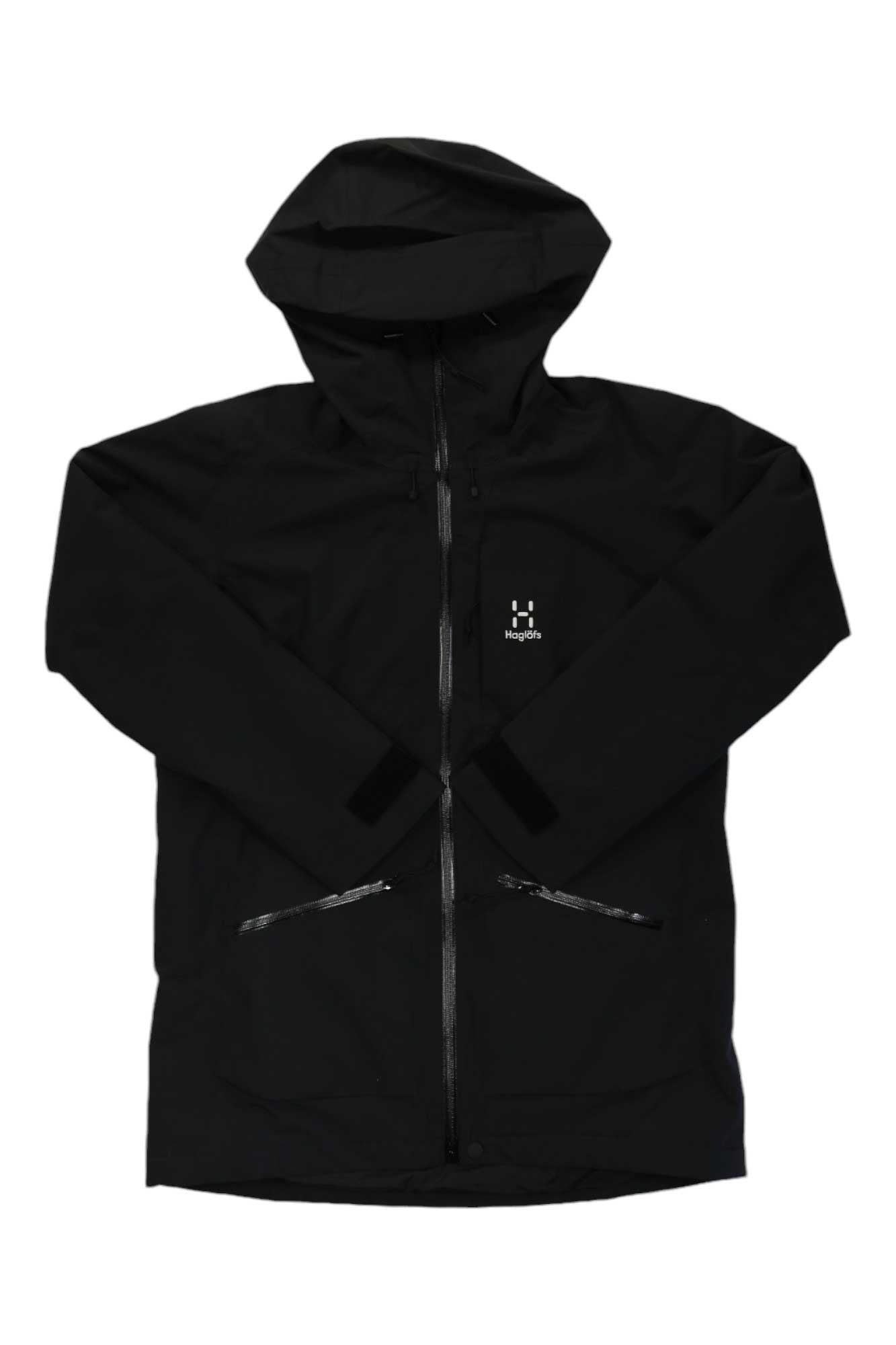 The Haglofs Womens Lumi Insulated Parka is a black waterproof ski jacket with a front zipper, two zippered pockets, and a small white chest logo. Made from recycled polyester, it’s shown laid flat with sleeves crossed in front.