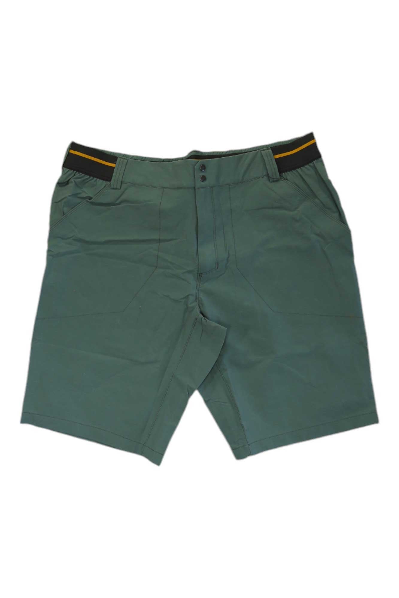 The Rab Men’s Venant 11 Inch Short is a green knee-length hiking short with a front zipper, button closure, black waistband featuring a yellow stripe, water-resistant fabric, and 4-way stretch. Shown laid flat on a white background.