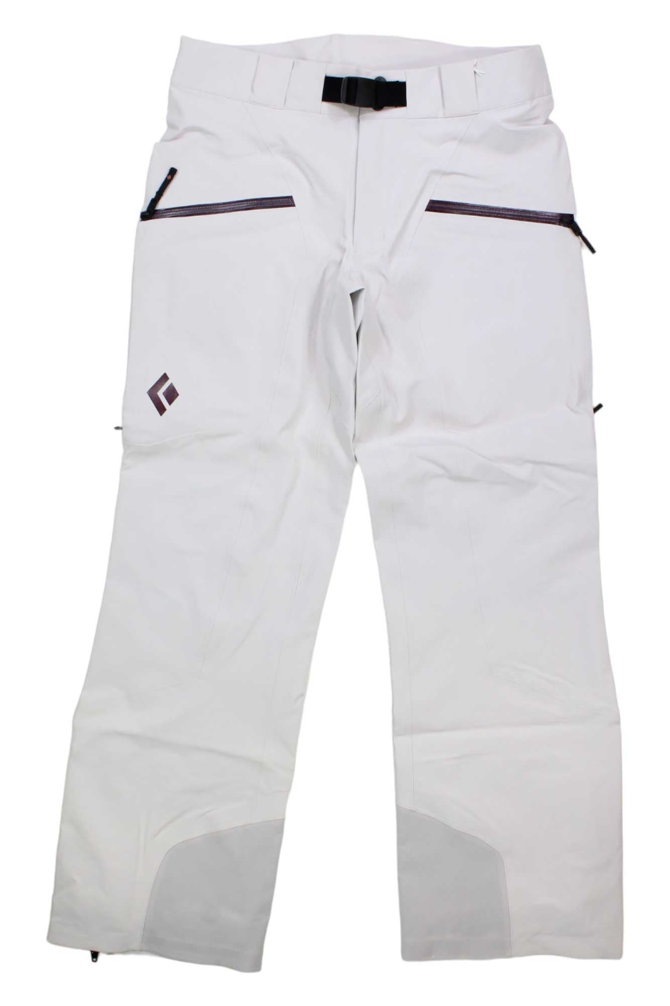 The Black Diamond Womens Recon Stretch Ski Pant is a durable, waterproof ski pant for backcountry skiing, with black zippered side pockets, a black belt, reinforced gray inner ankle patches, and a geometric logo on the left thigh.