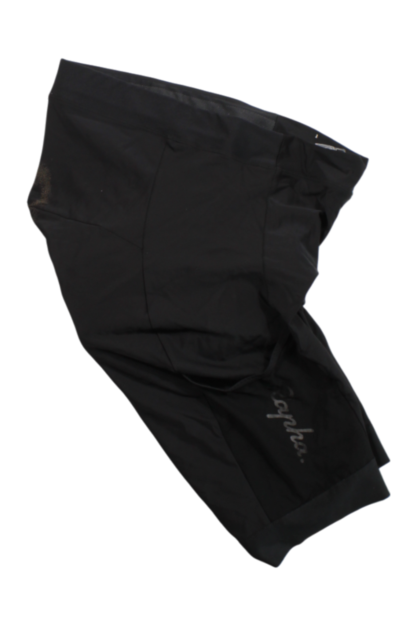 A pair of Rapha Core Cargo Shorts in black with visible stitching and Rapha branding on one leg, laid flat on a white background.