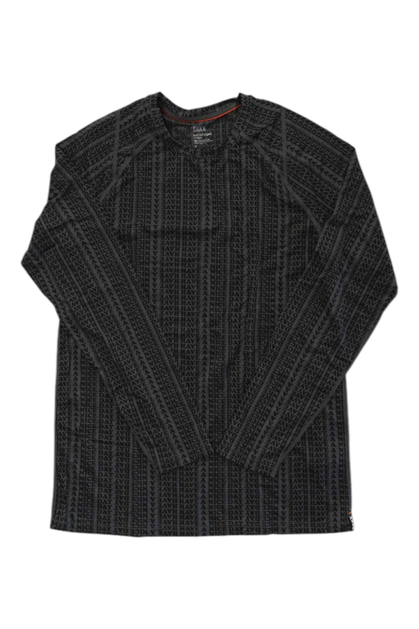 The SAXX Men's Viewfinder LS Crew features black and dark gray geometric patterns, a crew neckline, and a subtle textured design. Ideal for hiking, this long-sleeve shirt is shown laid flat on a white background.