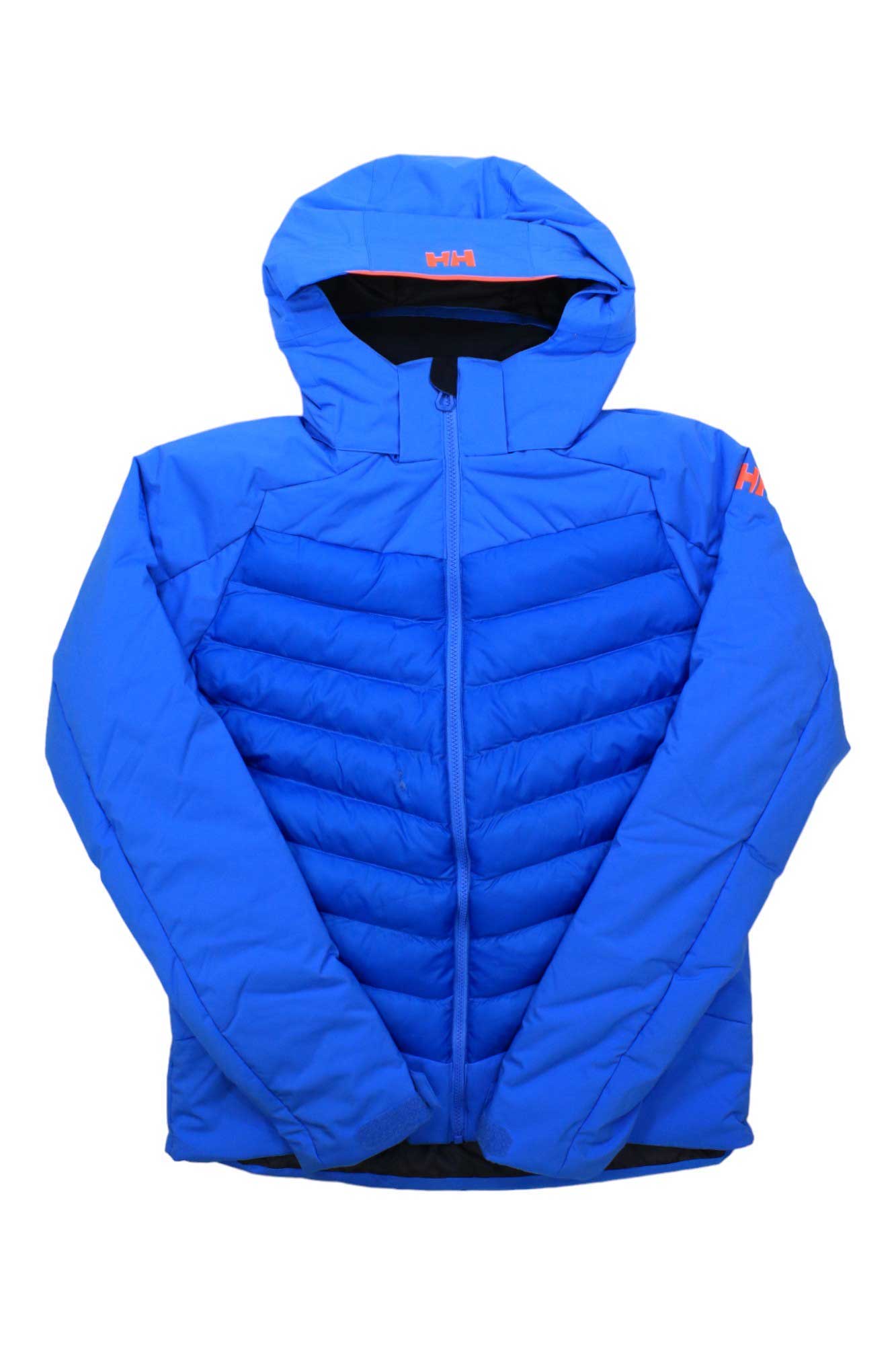 The Helly Hansen Juniors Serene Jacket is a bright blue, insulated waterproof jacket with a hood, front zipper, chevron quilting, and orange Helly Hansen logos on the chest and upper sleeve.