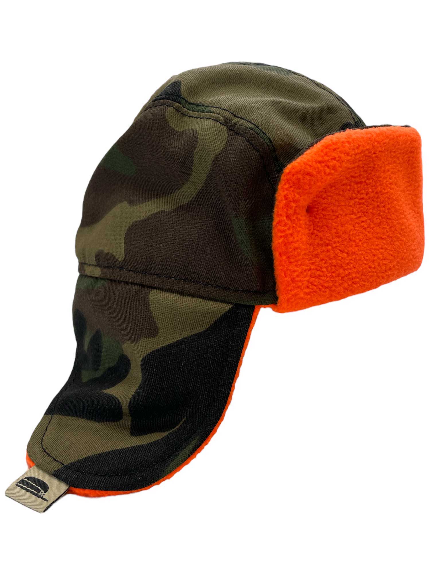 The Stormy Kromer Kids The Kit Trapper Hat, made in the USA, features a camouflage design with vibrant orange ear flaps and lining—ideal for snowsports adventures.