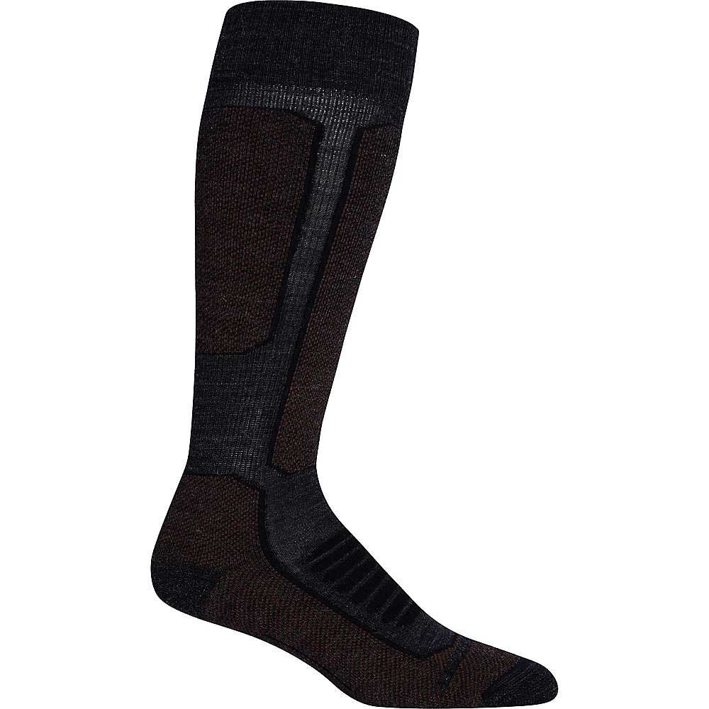 The Icebreaker Womens Ski+ Medium Over The Calf Sock in black and dark brown, made from merino wool with reinforced padding on the shin, heel, and toe, is shown as a single sock against a plain white background.