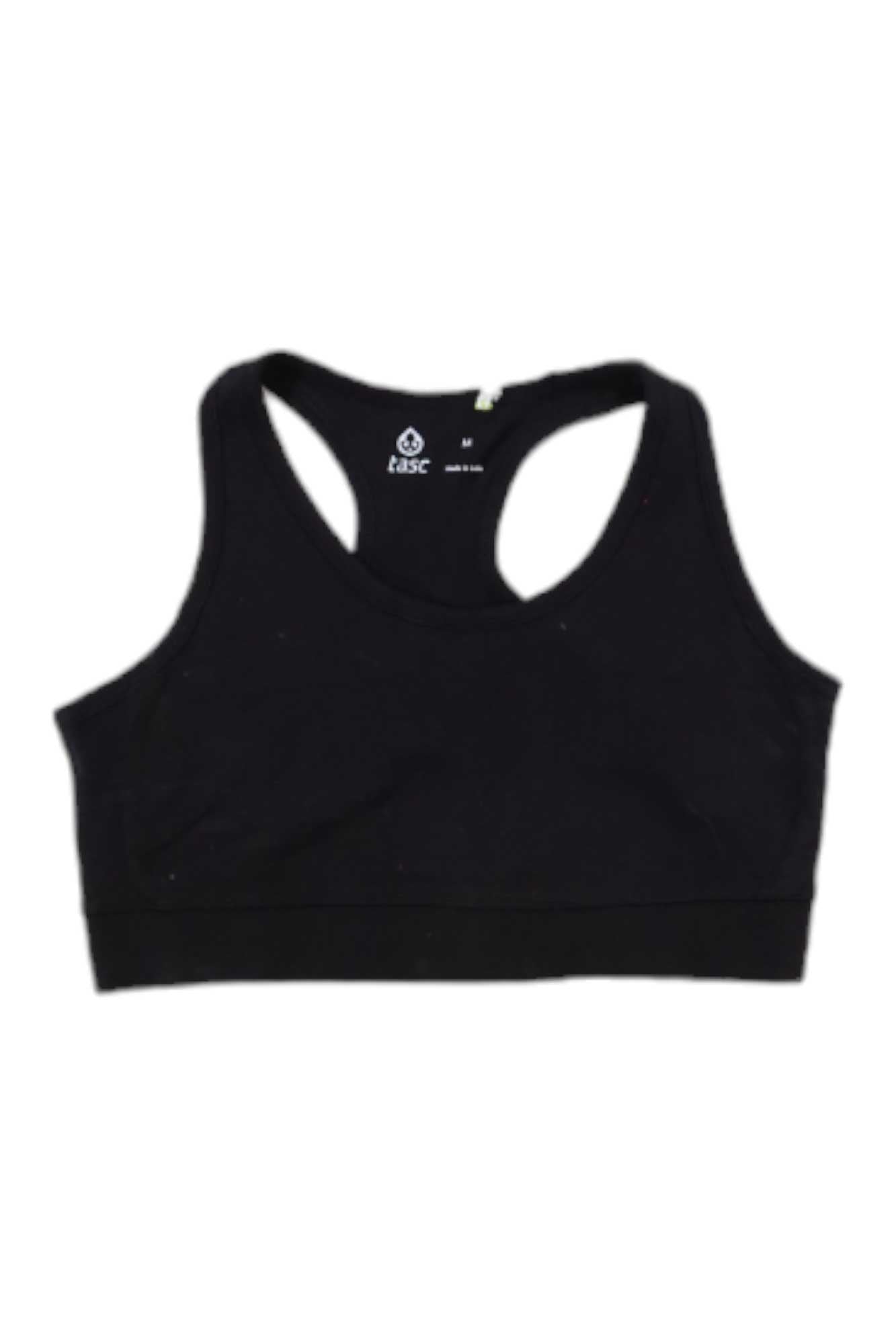 The Tasc Womens ALLways Sports Bra, a plain black racerback with a scoop neckline made from moisture-wicking fabric, is shown laid flat on a white background.