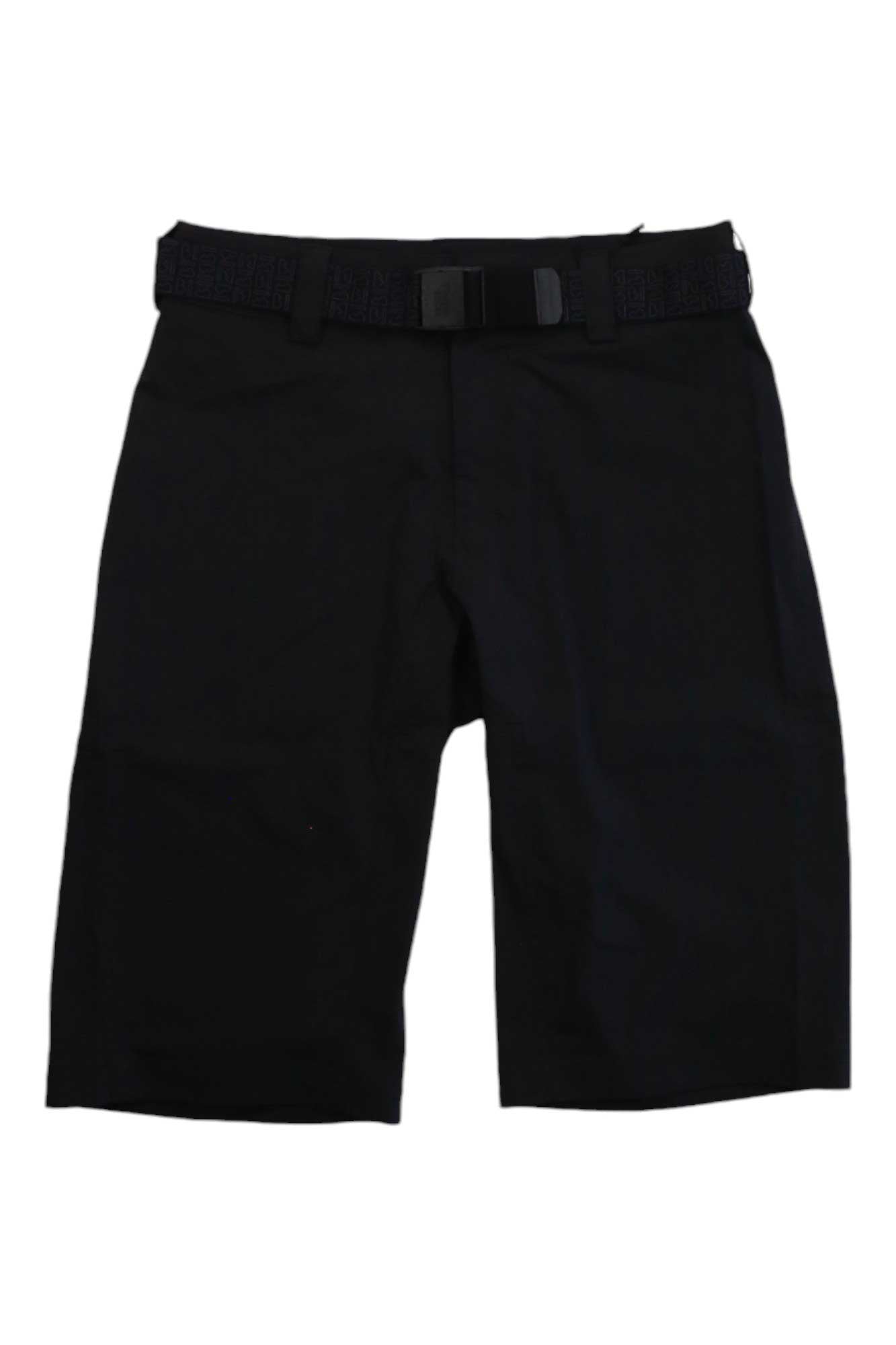 Mons Royale Mens Virage Bike Short in black, knee-length with a built-in black belt and buckle, displayed flat on a white background.