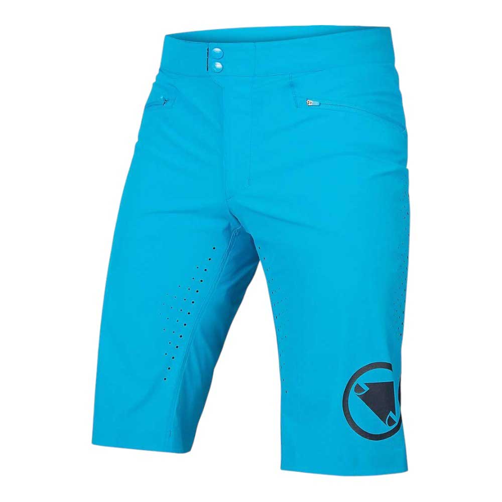 The Endura Mens SingleTrack Lite Short is a bright blue, knee-length stretch nylon short with front ventilation holes, a large black circular logo, flat waistband, button closure, and two front zippered pockets—perfect for mountain biking.