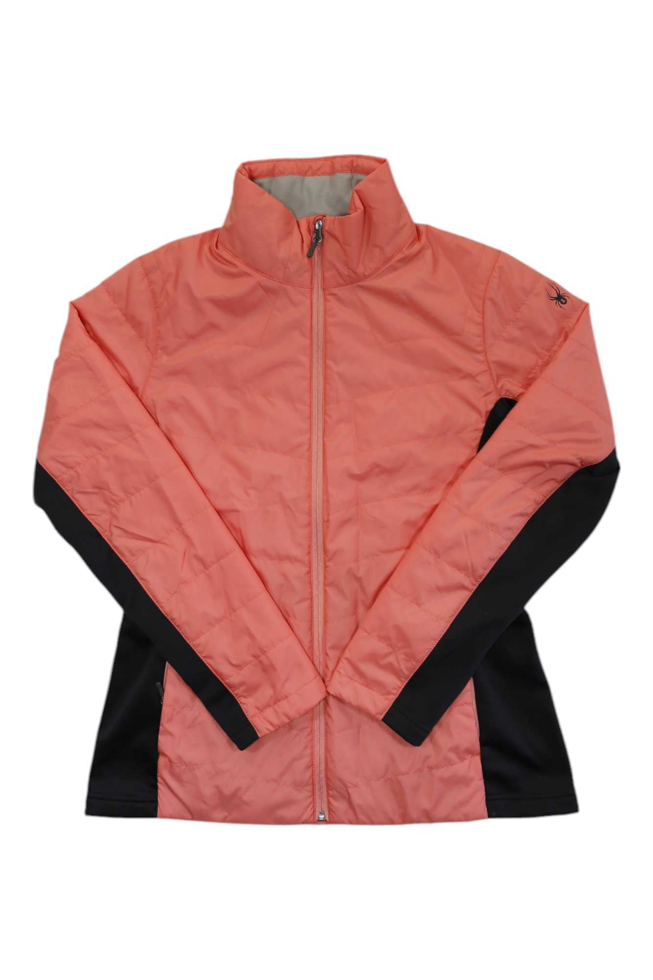 The Spyder Womens Peak Jacket in coral pink features black side panels, a high collar, long sleeves, and 3M Thinsulate insulation. Shown laid flat on a white background.