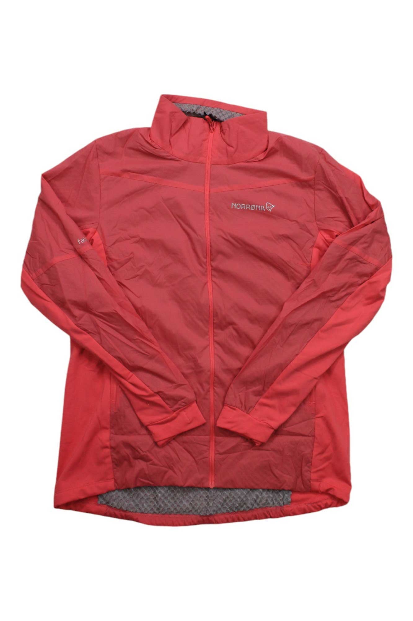 The Norrona Womens Falketind Octa Jacket is a red, long-sleeve, zip-up outdoor jacket made from lightweight recycled nylon, featuring the Norrona logo on the left chest and a slightly longer back hem.
