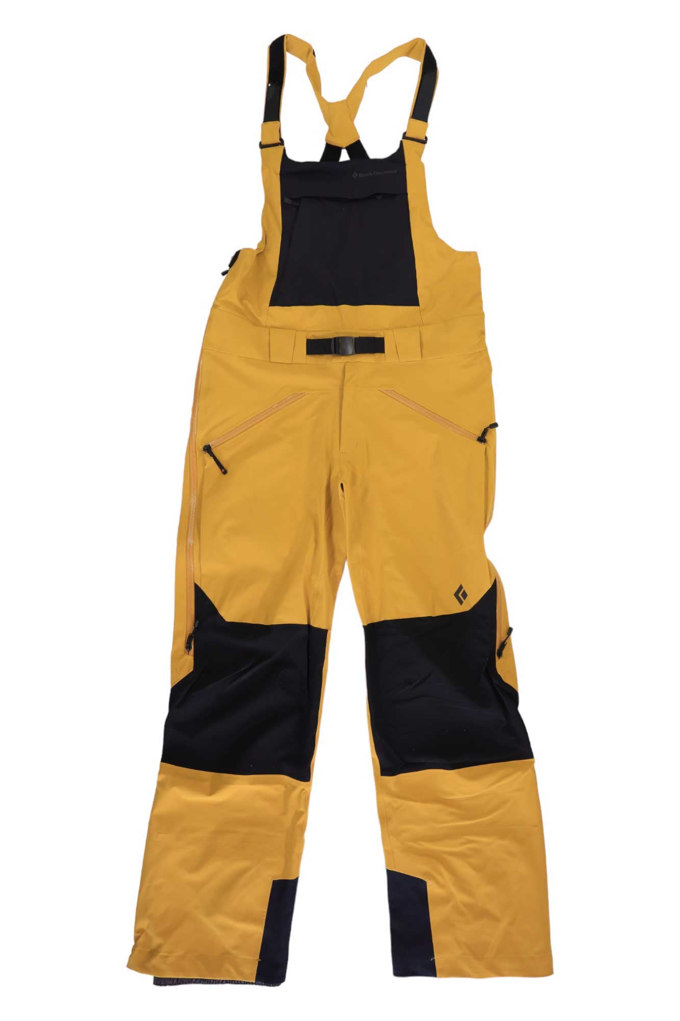 The Black Diamond Mens Recon Stretch Bib features yellow and black waterproof stretch fabric, adjustable shoulder straps, chest pocket, belt, reinforced knees and ankles, zippered pockets, and durable design for men's winter outdoor activities.
