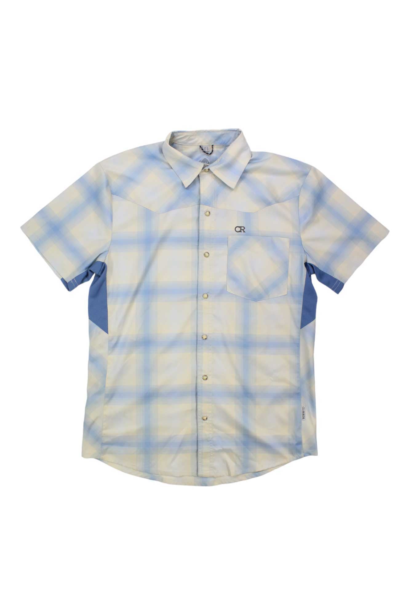The Club Ride Men's New West Shirt is a short-sleeve button-up with light blue, yellow, and white plaid, a front chest pocket, moisture-wicking fabric, UPF 50 sun protection, collar, blue side panels, and an OR logo above the pocket.