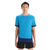 A person faces forward wearing the Icebreaker Mens Zoneknit SS Tee in bright blue with dark blue sleeve and hem trim, made from breathable fabric, paired with black shorts against a plain white background.