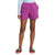 A person stands against a white background wearing a light blue long-sleeve top, black sandals with white text, and The North Face Women's Class V Short in bright pink. Their hands are in their pockets and the shorts have a relaxed fit.