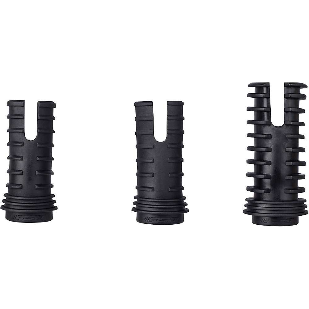 Three black rubber arrow nocks stand upright in a row: two plain with central slits, and the rightmost featuring ribbed sides for extra grip—similar to a Full Speed Ahead Di2 Seatpost Battery Plug for precision and control.