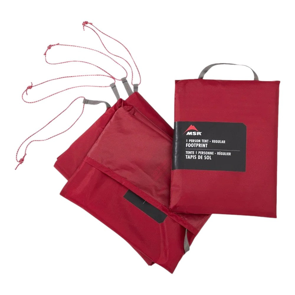 Red universal footprint mat with carry bag, folded fabric pieces shown